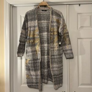 Long sweater with metallic accents. Nic and Zoe